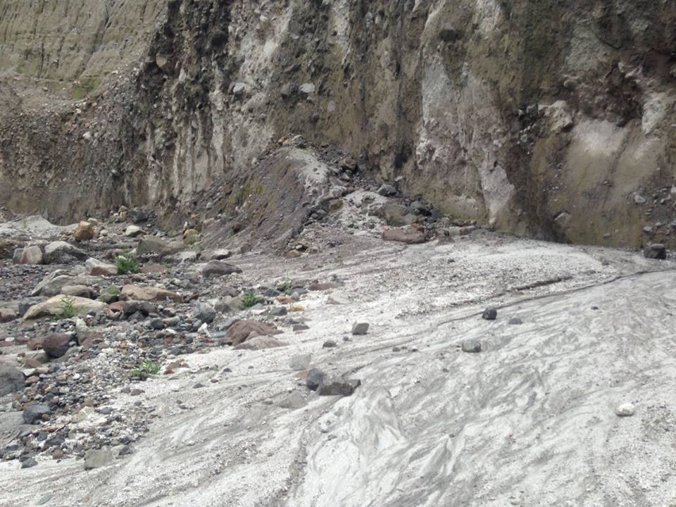 Rocks are scattered at the base of cliffs.