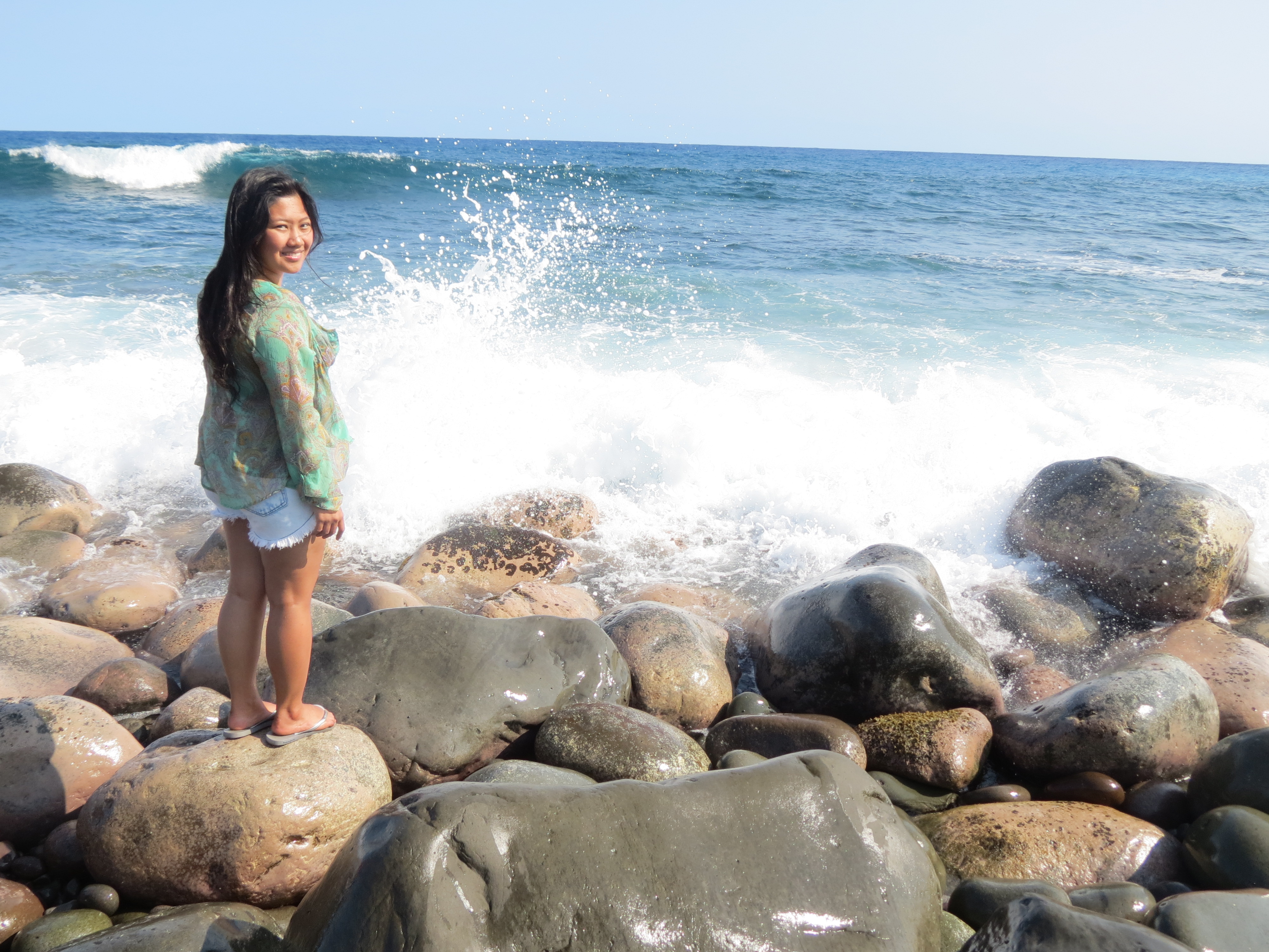 Strong waves smashing against volcanic rocks
