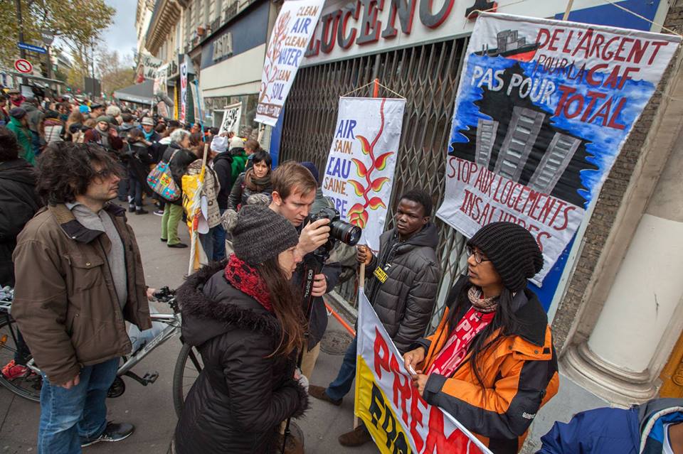 Paris 2015. Together with Tashi of the People's Pilgrimage and Japy of RARE, I stood along the indigenous people from all over the world in this segment of the ‪#‎HumanChain‬ for ‪#‎ClimateJustice‬. Photo by Mona Caron.