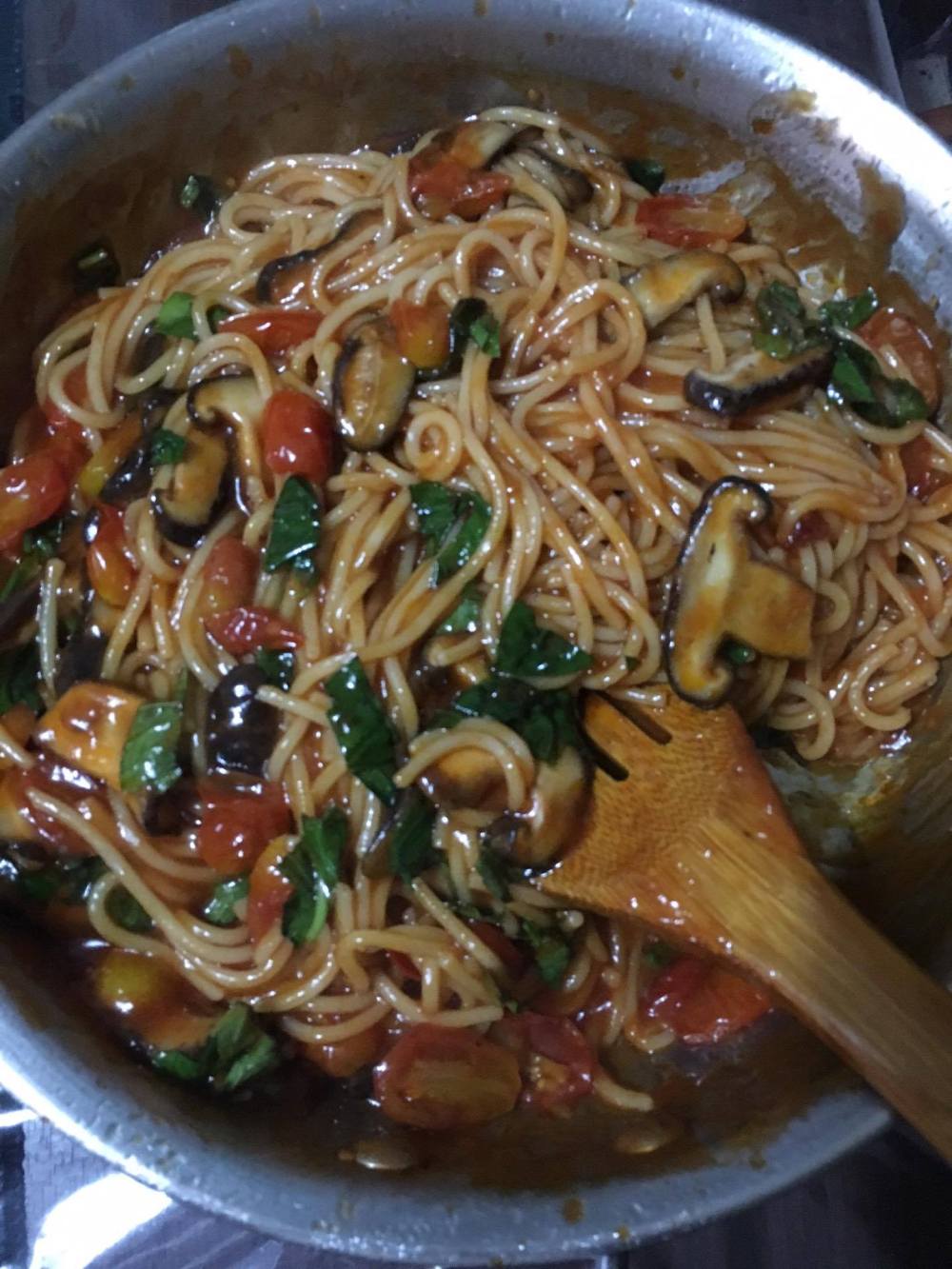 Vegan tomato pasta with mushroom and basil.