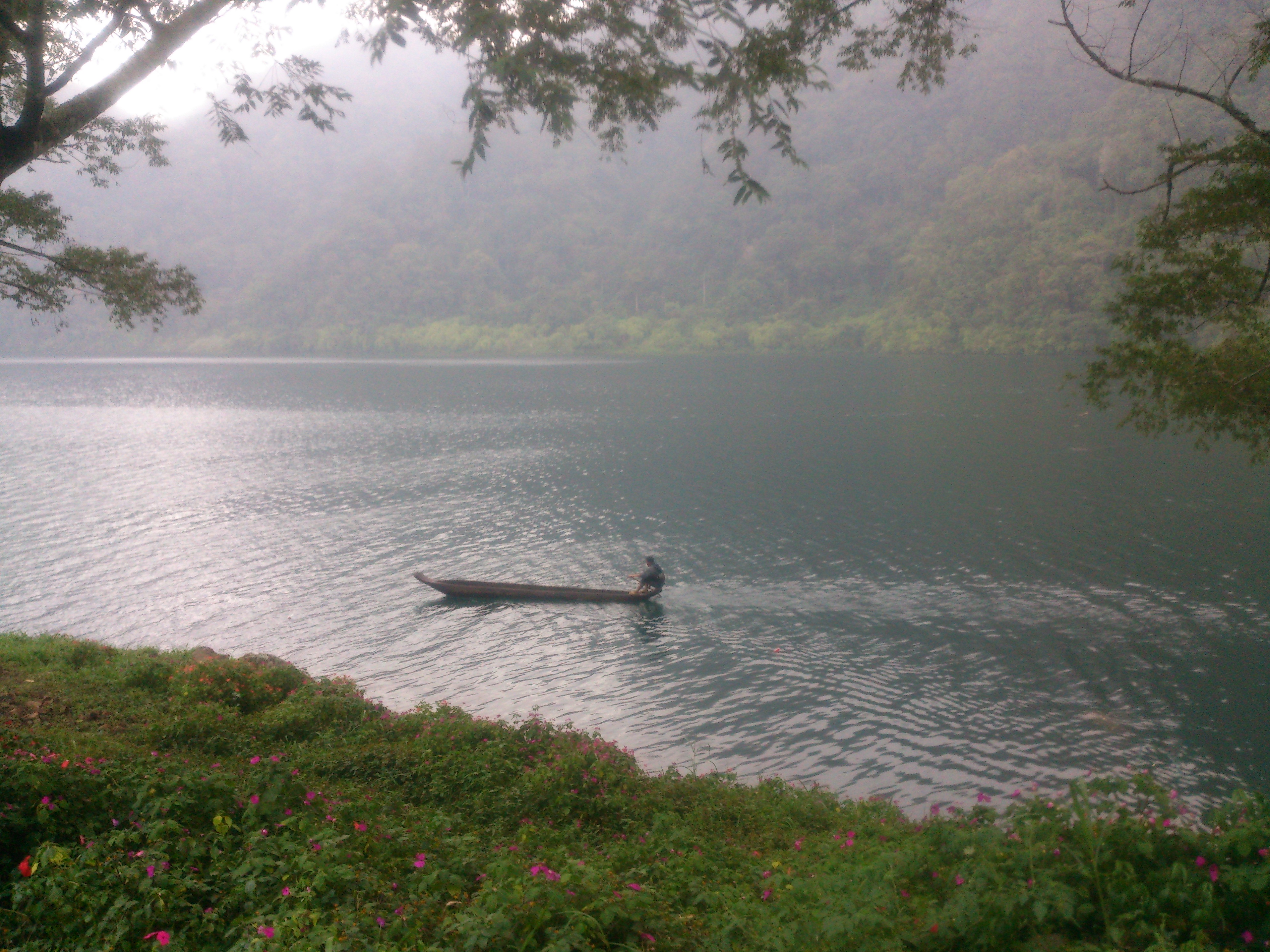 A Tboli man in a traditional dugout canoe paddles through Lake Holon in Mt Melibingoy_2015