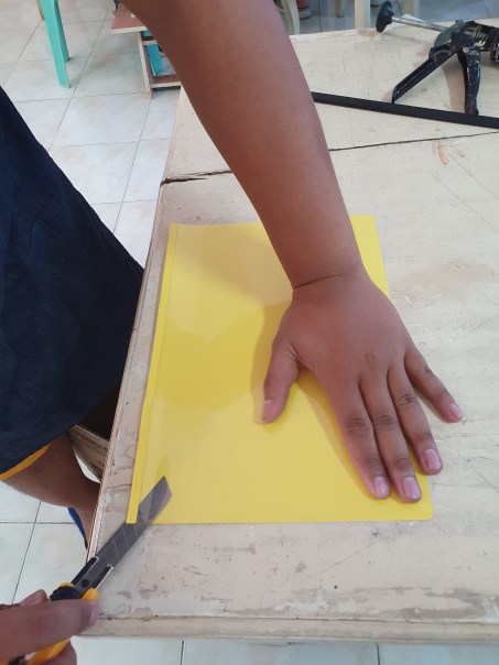 Prep Step 1.1: If the available material is Clear Folder, use a cutter to remove the paper back cover.