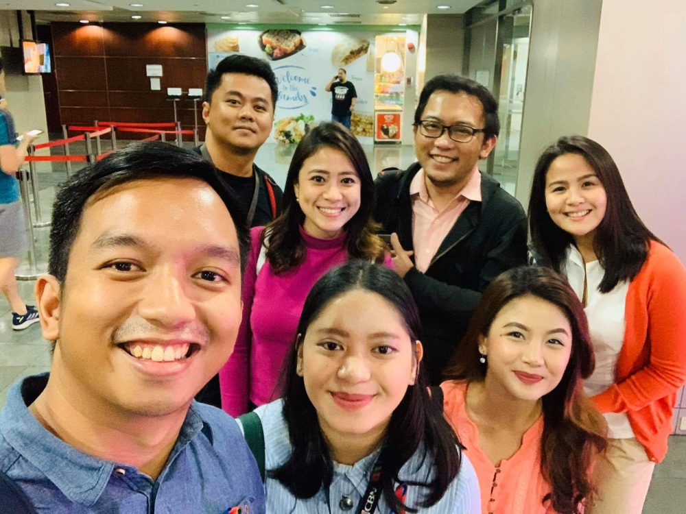 TV reporter with colleagues